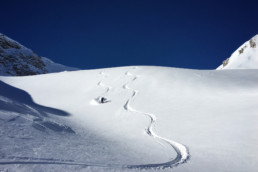 Fresh tracks in the powder off piste in Courchevel