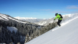 Skiing off piste powder slopes with a guide