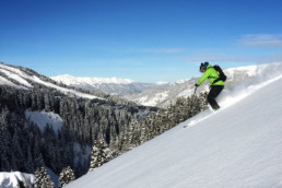 Skiing off piste powder slopes with a guide