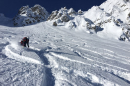 Skiing the deep snow off piste with a guide in Courchevel