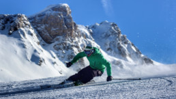 A skier carving down a piste in a private ski lesson in Courchevel 1850 1650