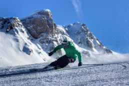 A skier carving down a piste in a private ski lesson in Courchevel 1850 1650